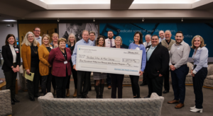Group of people with a giant check donation