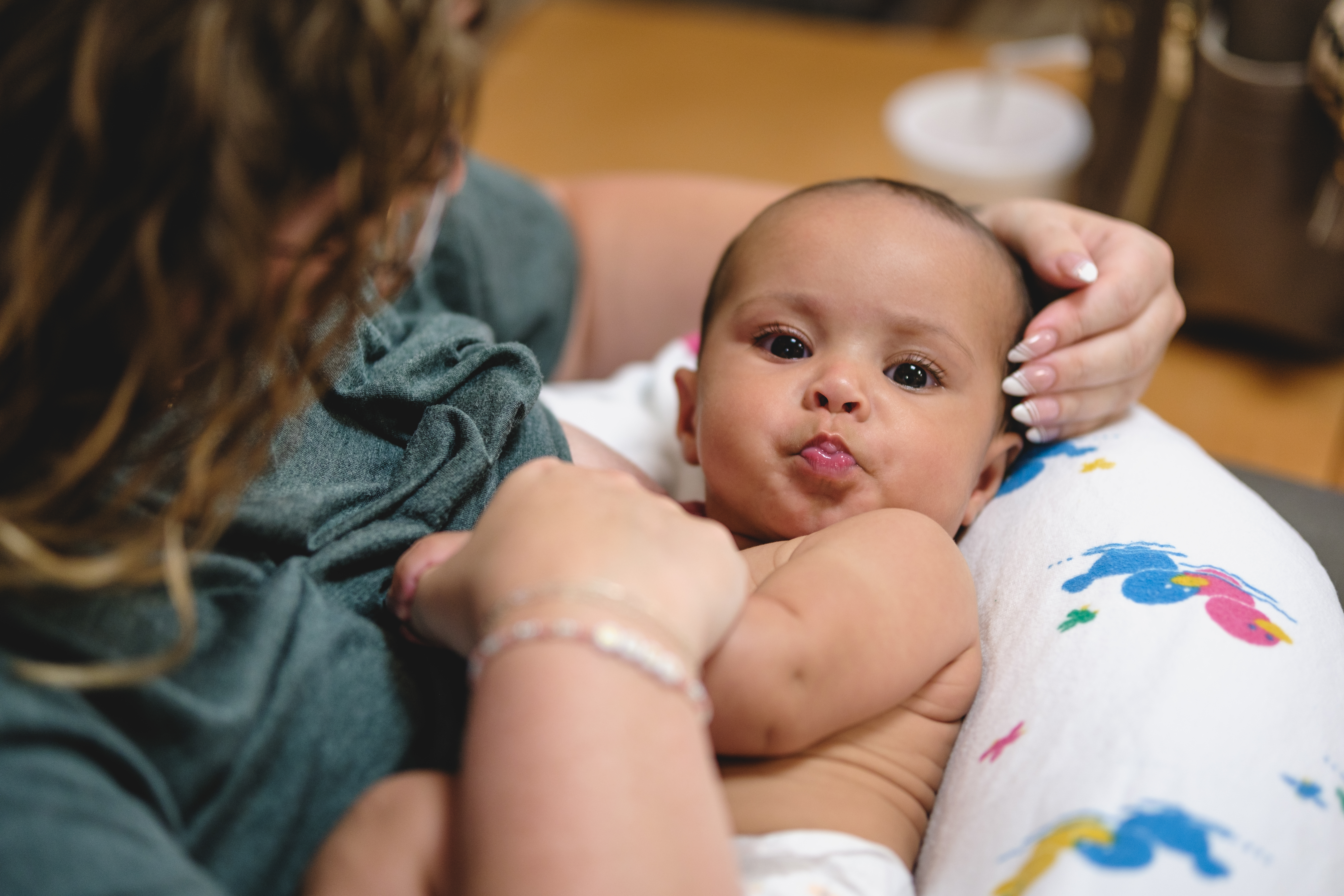 A mom about to breastfeed her baby at Stormont Vail Breastfeeding clinic