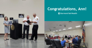 Ann Garcia-Brinker receiving award from the Shawnee Heights Fire Department.