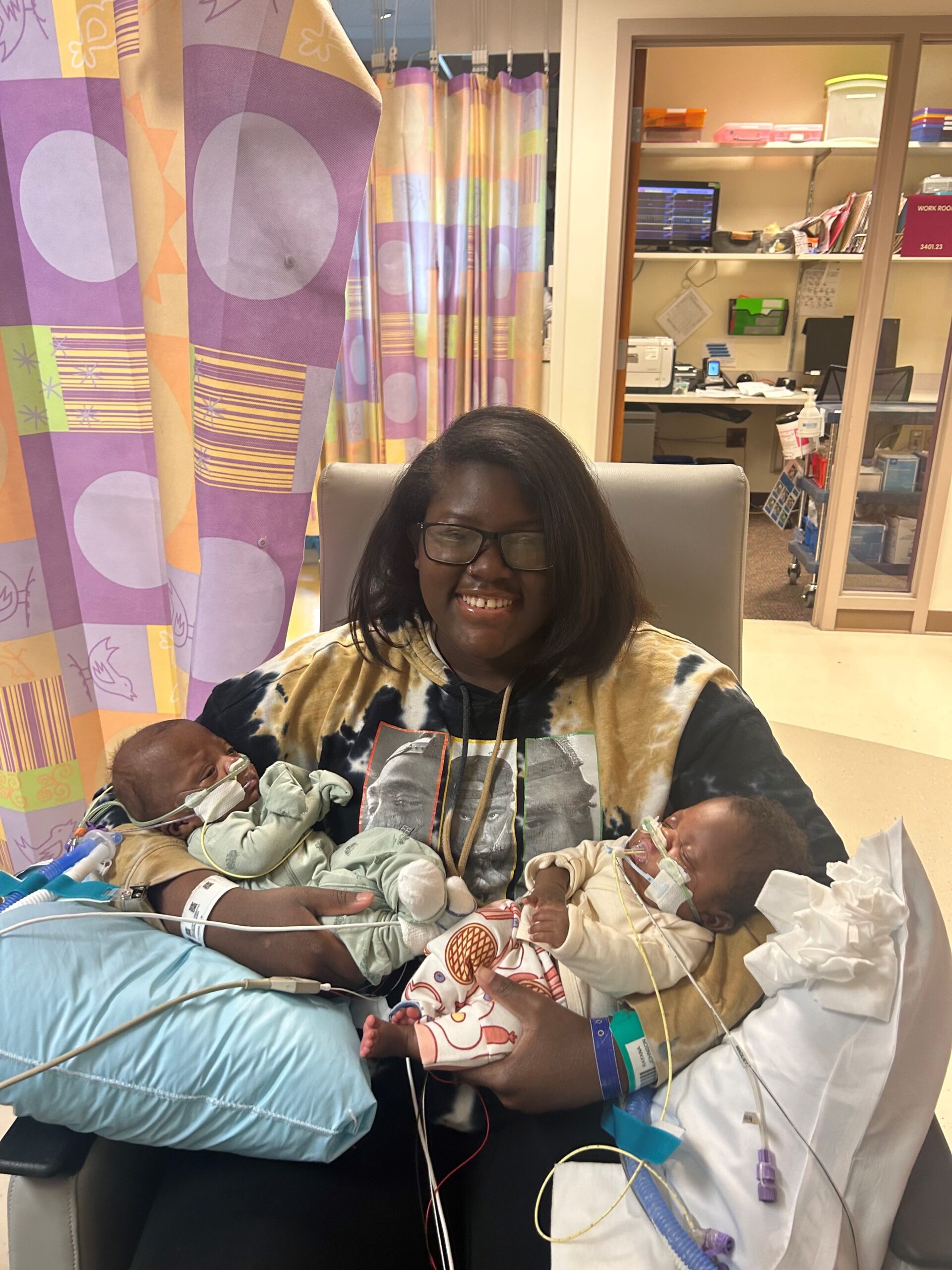 Rayana holding Elijah and Jeremiah at Children's Mercy