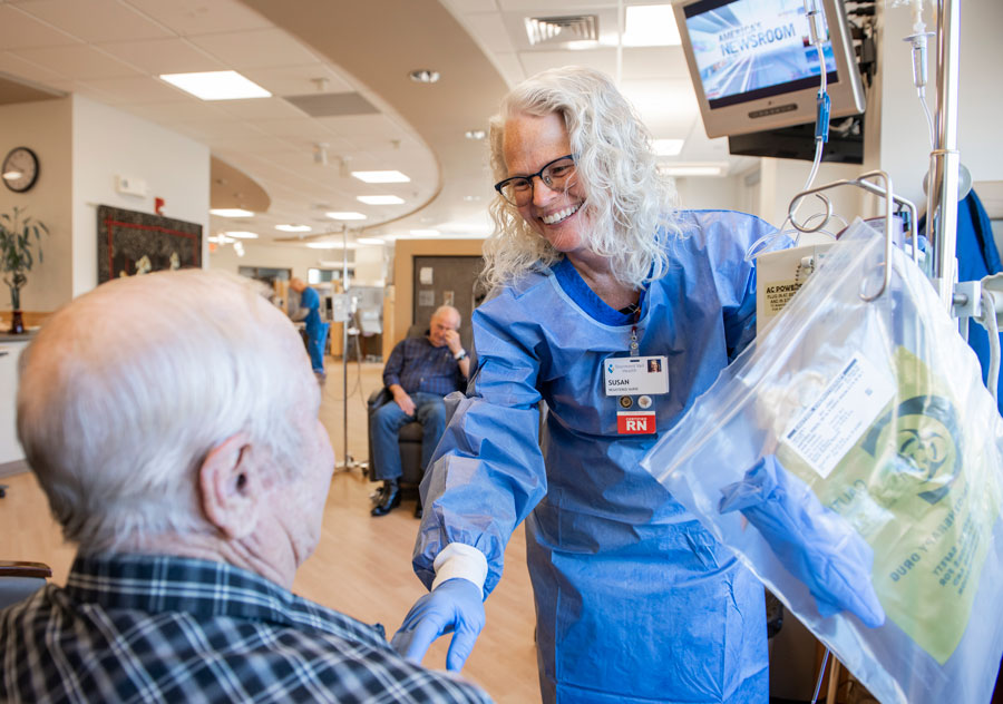 Susan-Parry-Care-Center Nurse talking with a patient