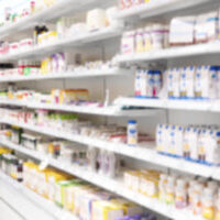 Medicine placed in shelves at Pharmacy. Side View of medicines, health products and health food in defocus.